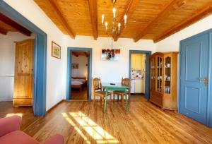 a living room with a table and a dining room at Haus-Wolfram-App-Wilhelmine in Morsum +13 photos