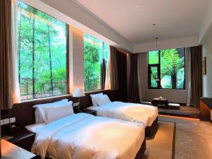 Krevet ili kreveti u jedinici u okviru objekta Chengdu Guiyuan Hotel