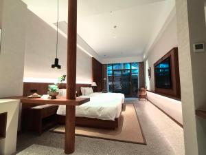 Krevet ili kreveti u jedinici u okviru objekta Chengdu Guiyuan Hotel