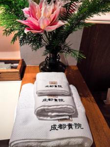 Krevet ili kreveti u jedinici u okviru objekta Chengdu Guiyuan Hotel