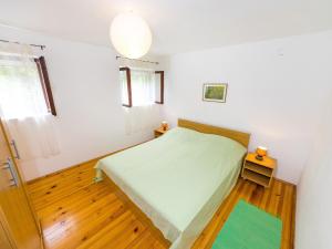 Postel nebo postele na pokoji v ubytování Shisha Stone House