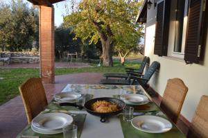 a table with a bowl of food on a patio at L'Oasi della Fonte in Albanella