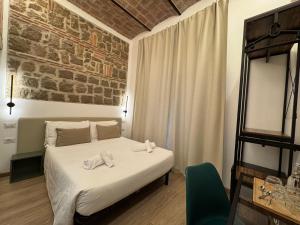 Postel nebo postele na pokoji v ubytování Hotel Felice