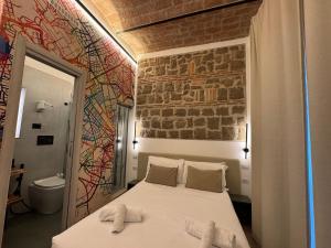 Postel nebo postele na pokoji v ubytování Hotel Felice