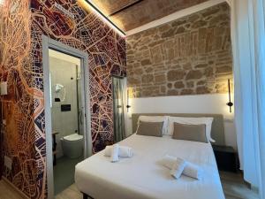 Postel nebo postele na pokoji v ubytování Hotel Felice