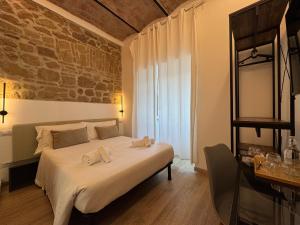 Postel nebo postele na pokoji v ubytování Hotel Felice