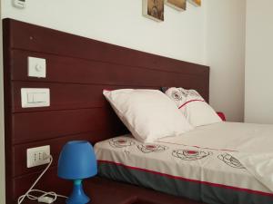 Postel nebo postele na pokoji v ubytování The Den Guest House