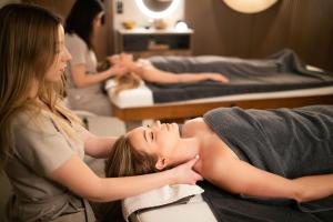 a woman getting a massage in a salon at GRANO HOTEL Solmarina in Wiślinka