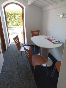 a room with a table and chairs and a window at HEDRA in Zambratija +14 photos