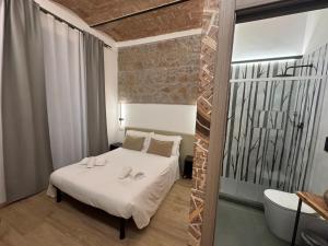 Postel nebo postele na pokoji v ubytování Hotel Felice
