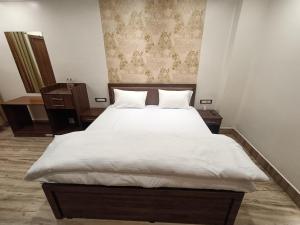 Swet Palash Resort客房内的一张或多张床位