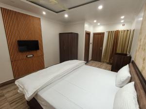 Swet Palash Resort客房内的一张或多张床位