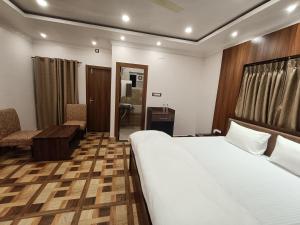 Swet Palash Resort客房内的一张或多张床位