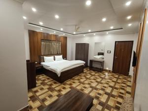 Swet Palash Resort客房内的一张或多张床位