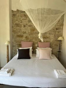 Posteľ alebo postele v izbe v ubytovaní Garden Village House in Pythagorio-Hora, Samos Island