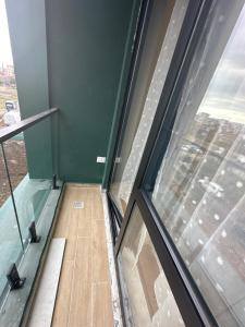 an empty room with a window in a building at SISI Apartment in Tirana +37 photos