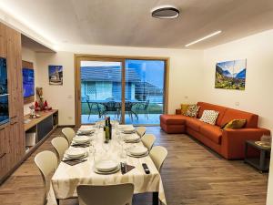 a living room with a table and a couch at Holiday Home Guarnelle House 1 by Interhome in Bianzone +40 photos