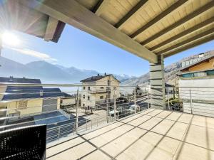 a balcony with a view of the mountains at Holiday Home Guarnelle House 1 by Interhome in Bianzone