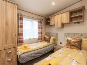 Voodi või voodid majutusasutuse Chalet Cairn View by Interhome toas