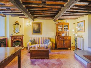 a living room with a couch and a fireplace at Holiday Home Souvenir by Interhome in Santa Lucia +30 photos