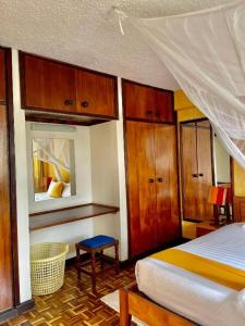 Postel nebo postele na pokoji v ubytování Kenya Comfort Suites