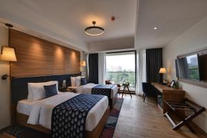 Clarion Hotel Khayal Kochi, Infopark客房内的一张或多张床位