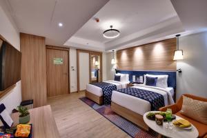 Clarion Hotel Khayal Kochi, Infopark客房内的一张或多张床位