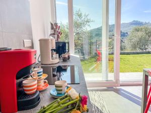 a kitchen with a counter with vegetables on a counter top at Holiday Home Villa Milu by Interhome in Imperia
