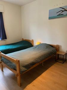 Postel nebo postele na pokoji v ubytování Ruime woning nabij Antwerpen en haven