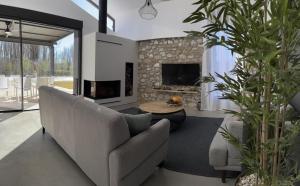 a living room with a couch and a fireplace at El Corral de Jirueque in Jirueque