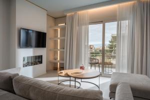 Televiisor ja/või meelelahutuskeskus majutusasutuses Selas Spacious fully equipped 3 BDR Apt by Hospi