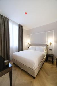 Postel nebo postele na pokoji v ubytování BH Hotel