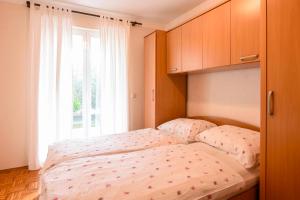 Postel nebo postele na pokoji v ubytování Holiday Apartments Zora