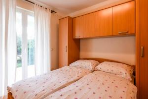 Postel nebo postele na pokoji v ubytování Holiday Apartments Zora