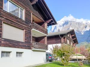 a house with a view of the mountains at Apartment SnowKaya Grindelwald by Interhome in Grindelwald