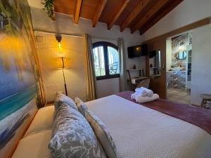 a bedroom with a bed with a stuffed animal on it at Hotel Altea Paradise 1917 - Adults Only in Altea