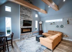a living room with a couch and a fireplace at Cozy One Bedroom Apartment- Downtown Moncton in Moncton
