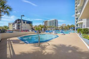 a swimming pool in the middle of a building at Oceanfront Oasis 1002 in Abbeyville