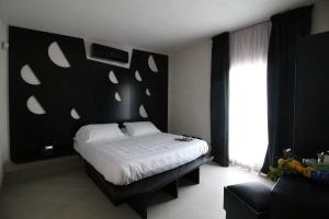 Voodi või voodid majutusasutuse Addauro Resort toas