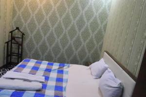 Postel nebo postele na pokoji v ubytování Ekm Hotel