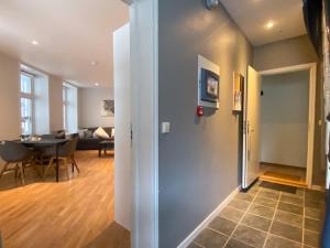 a hallway with a living room and a dining room at Dinbnb Apartments I 500m to Bryggen in Bergen