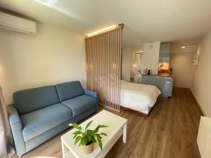 a living room with a couch and a bed at Splendid Studio With Swimming Pool Next To Monaco in Beausoleil +9 photos