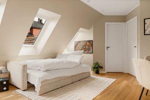 Ένα ή περισσότερα κρεβάτια σε δωμάτιο στο Dinbnb Apartments Bryggen