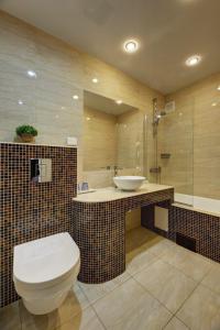 a bathroom with a toilet and a sink at Narva-Jõesuu Medical Spa in Narva-Jõesuu