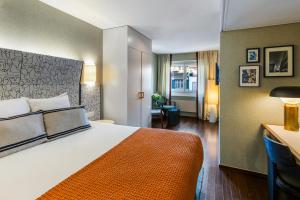 A bed or beds in a room at Hotel D - Basel - Fully Renovated 2025