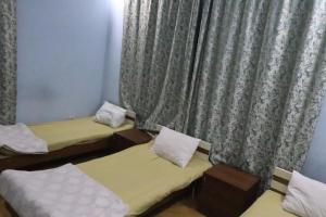 Postel nebo postele na pokoji v ubytování Ekm Hotel