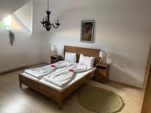 Giường trong phòng chung tại Pension La Noblesse