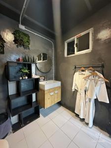 a bathroom with a sink and a mirror at Apple house cafe in Ban Rong Fong +75 photos
