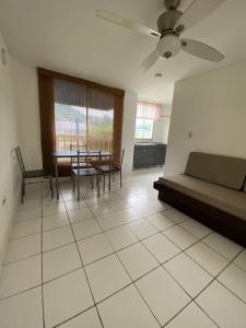 a living room with a couch and a table at Najhomi Beach in Santa Marta