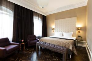 En eller flere senger på et rom på Elite Hotel Adlon